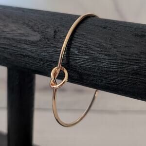 Gold Tone Cuff Bracelet with Knot Design